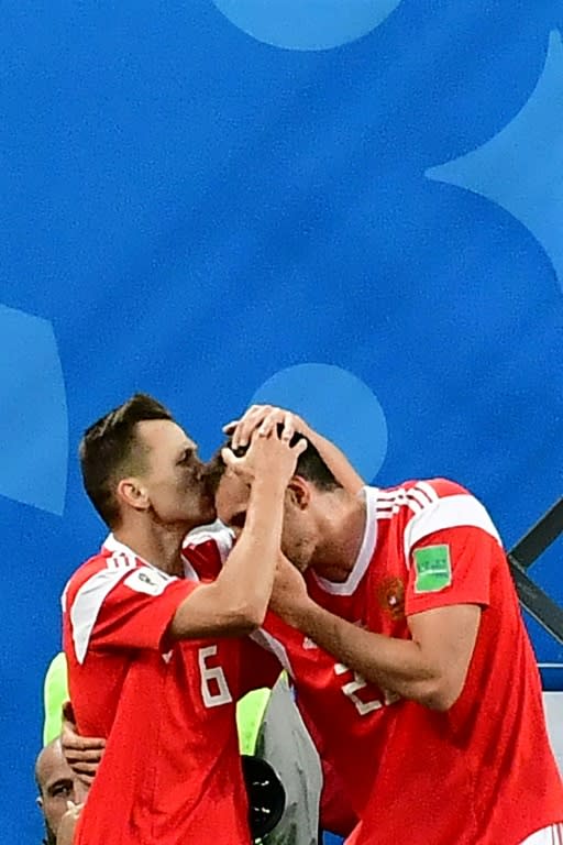 Denis Cheryshev, on the left, celebrates with teammate Artem Dzyuba