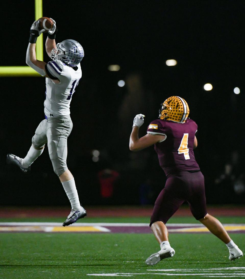 Bloomington South’s Ben Godar (16) intercepts a pass intended for Bloomington North’s Aidan Steinfeldt (4) during the IHSAA sectional semi-final football game at Bloomington North on Friday, Oct. 27, 2023.