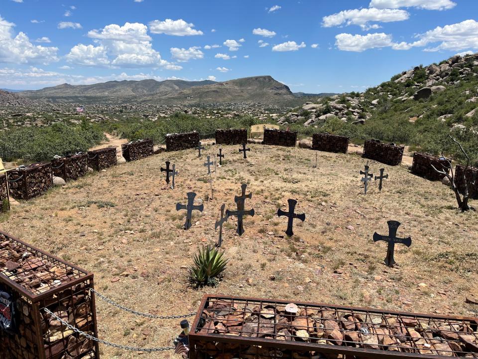 The site where 19 members of the Granite Mountain Hotshot crew perished while fighting the Yarnell Hill Fire on June 30, 2013 is marked with crosses for each of the victims and surrounded by barriers.