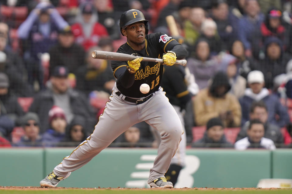 Pittsburgh Pirates' Ke'Bryan Hayes bunts for a single allowing Bryan Reynolds to score in the sixth inning of a baseball game against the Boston Red Sox, Wednesday, April 5, 2023, in Boston. (AP Photo/Steven Senne)