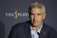 FILE - In this March 13, 2020 file photo, PGA Tour Commissioner Jay Monahan reacts to a question during a news conference at The Players Championship golf tournament, in Ponte Vedra Beach, Fla. After a three-month shutdown because of the COVID-19 pandemic, the tour has staged 36 events in 39 weeks without interruption. (AP Photo/Chris O'Meara, File)