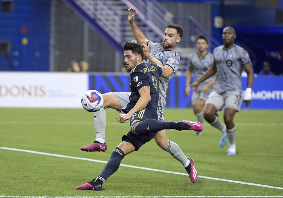 CF Montreal's Rudy Camacho, top center, challenges Philadelphia Union's Julian Carranza (9) during first-half MLS soccer match action in Montreal, Saturday, March 18, 2023. (Graham Hughes/The Canadian Press via AP)