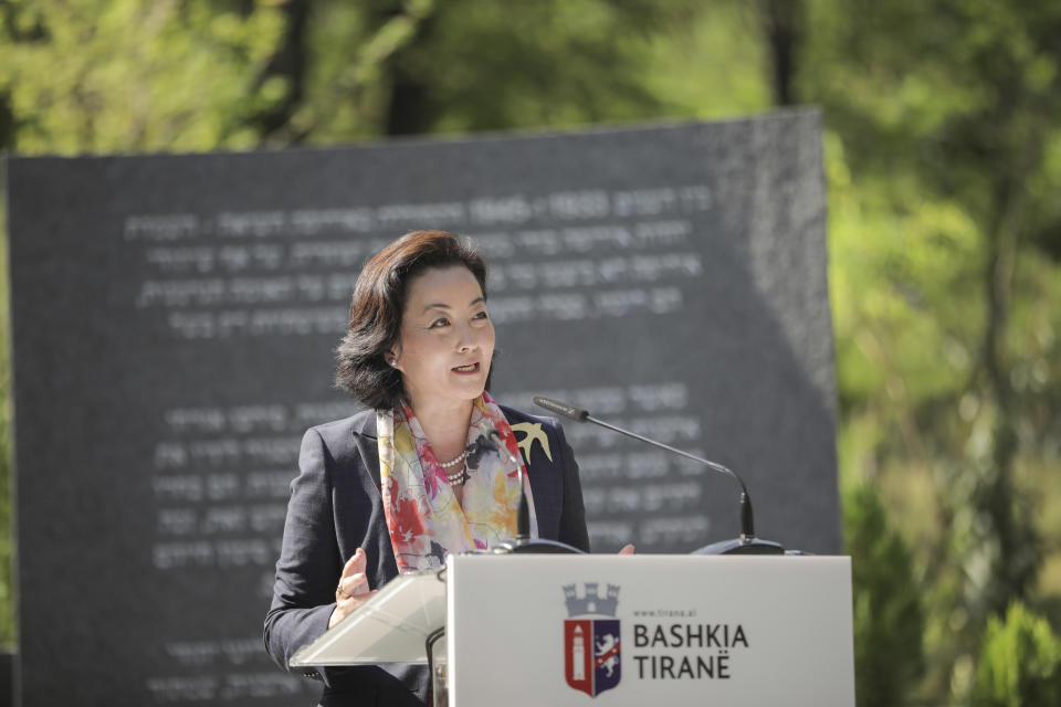 U.S Ambassador to Albania Yuri Kim speaks during the inauguration of a memorial in Tirana, Thursday, July 9, 2020. A memorial to the six million Jews murdered during the World War II and for the Albanians who protected them from the Nazis was inaugurated Thursday in the capital. (Xhulio Hajdari/Tirana City Hall via AP)