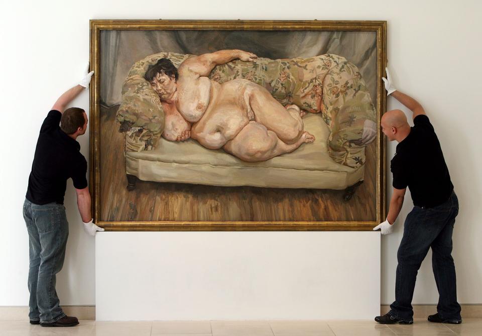 Christies' employees hang Lucian Freud's painting 'Benefits Supervisor Sleeping, 1995' on April 11, 2008 in London, England. The life-size 'Benefits Supervisor Sleeping, 1995' painting shows a naked Sue Tilley from London and is estimated to fetch between 25 to 35 million USD which would make it the most expensive auctioned artwork.