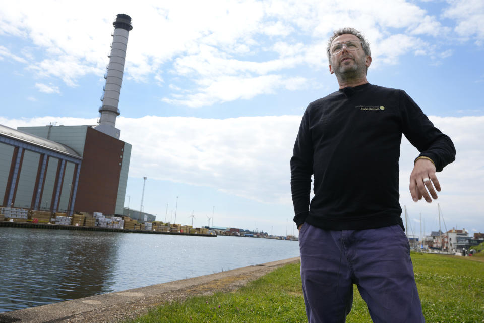 Matt Brown, New rojects Director at Brighton Energy Co Op speaks to Associated Press near Shoreham Port, East Sussex, England, Wednesday, June 12, 2024. There’s lots of talk of change in Britain’s election campaign, but little talk about climate change. The U.K.’s July 4 vote to choose a new government comes after one of the wettest and warmest winters on record, part of trends scientists attribute to global warming.(AP Photo/Kirsty Wigglesworth)