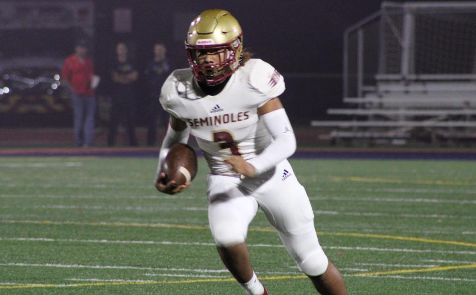 Florida High quarterback Tre Donaldson (3) carries the ball for the Seminoles in a Class 3A semifinal loss against Chaminade-Madonna on Dec. 3, 2021 in Hollywood.