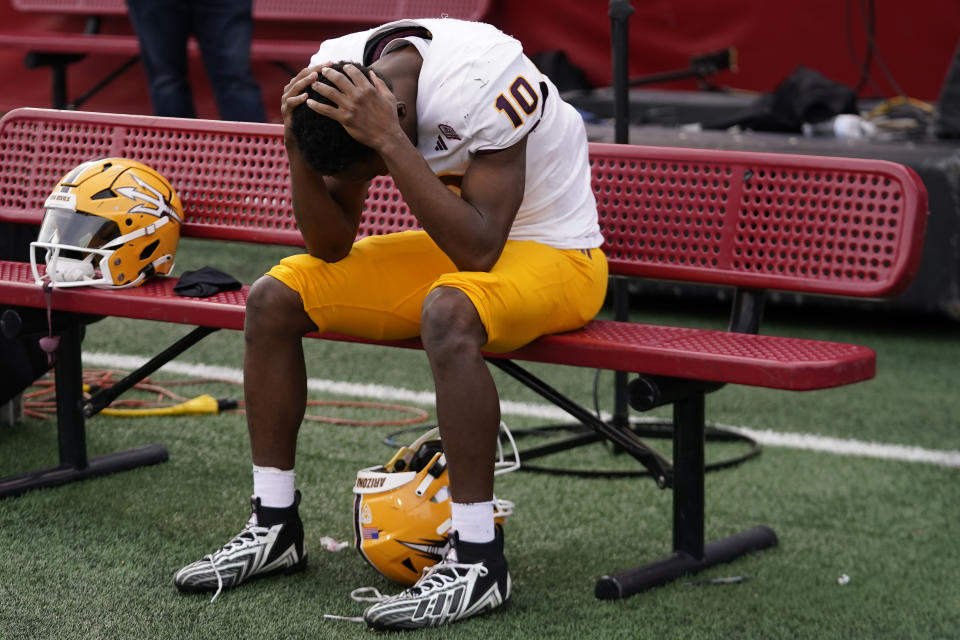 Arizona State defensive back Ed Woods (10) sits on the bench following their NCAA college football game against Utah Saturday, Nov. 4, 2023, in Salt Lake City. (AP Photo/Rick Bowmer)