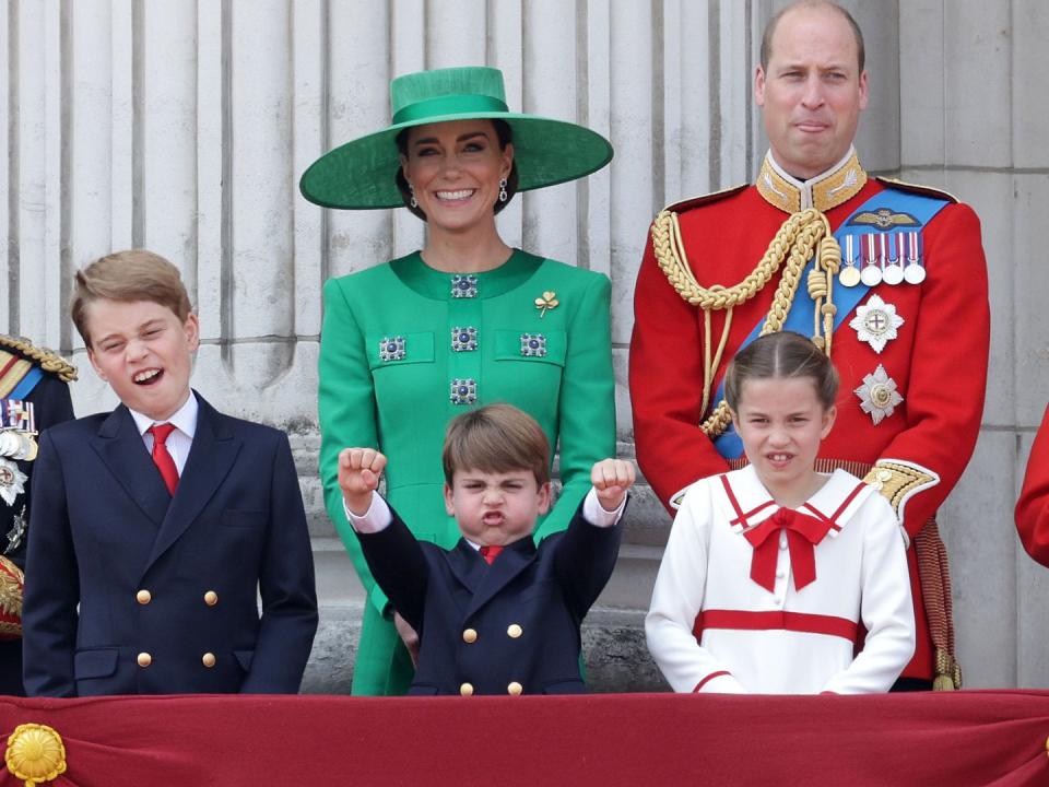 LONDON, ENGLAND - JUNE 17: Prince George of Wales, Prince Louis of Wales, Catherine, Princess of Wales, Princess Charlotte of Wales and Prince William, Prince of Wales stand on the balcony of Buckingham Palace to watch a fly-past of aircraft by the Royal Air Force during Trooping the Colour on June 17, 2023 in London, England. Trooping the Colour is a traditional parade held to mark the British Sovereign's official birthday. It will be the first Trooping the Colour held for King Charles III since he ascended to the throne.