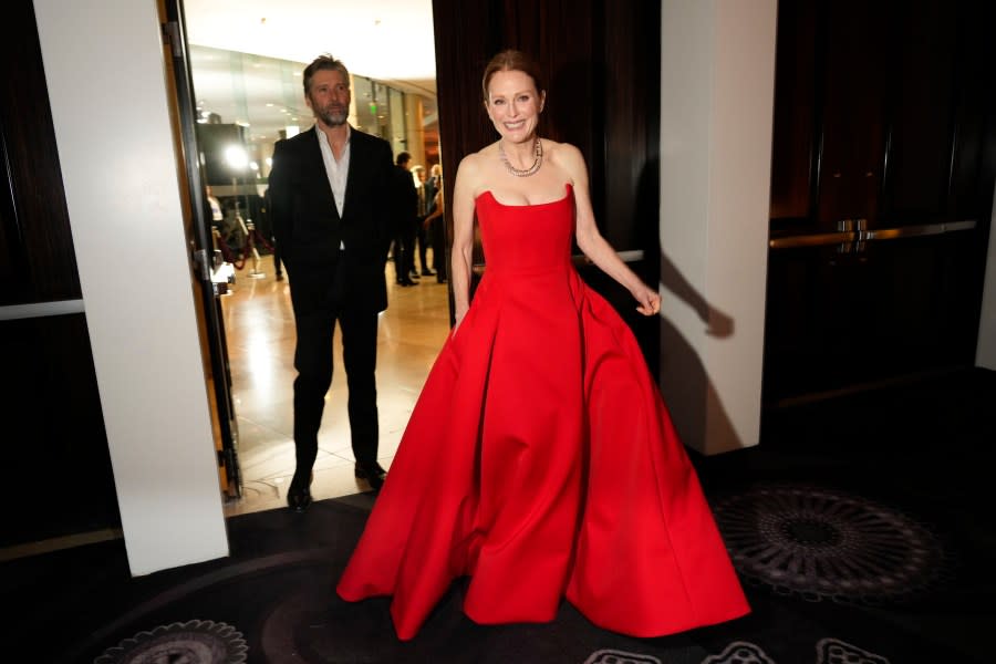 Bart Freundlich, left, and Julianne Moore arrive at the 81st Golden Globe Awards on Sunday, Jan. 7, 2024, at the Beverly Hilton in Beverly Hills, Calif. (AP Photo/Chris Pizzello)