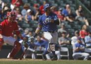Feb 28, 2019; Tempe, AZ, USA; Texas Rangers first baseman Ronald Guzman (11) hits a home run in the first inning during a spring training game against the Los Angeles Angels at Tempe Diablo Stadium. Mandatory Credit: Rick Scuteri-USA TODAY Sports