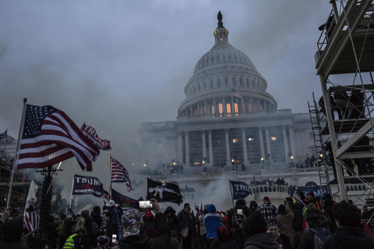 Security forces respond with tear gas after the US President Donald Trump's supporters breached the US Capitol security. Pro-Trump rioters stormed the US Capitol as lawmakers were set to sign off Wednesday on President-elect Joe Biden's electoral victory in what was supposed to be a routine process headed to Inauguration Day. (Probal Rashid/LightRocket via Getty Images)