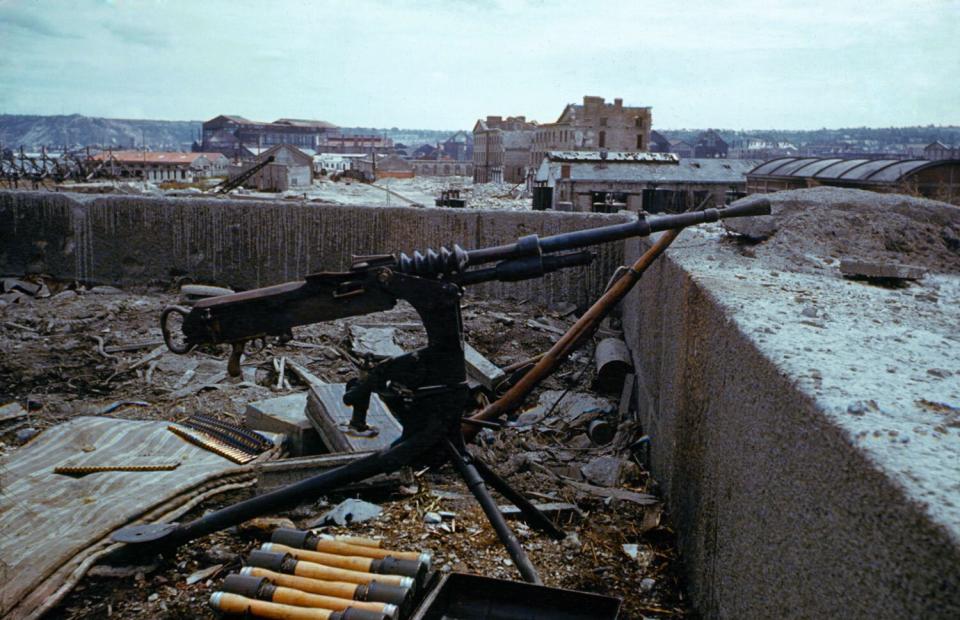 An abandoned German machine gun, France, June 1944.