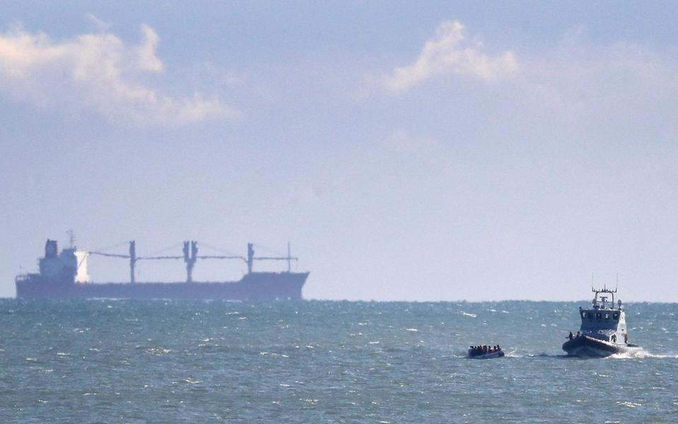 A Border Force vessel intercepts a group of people in a small boat thought to be migrants near Dover in Kent - Gareth Fuller / PA 