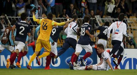 France's players celebrate winning their UEFA European Under-17 Championship final match against Germany in Burgas, Bulgaria May 22, 2015. REUTERS/Stoyan Nenov