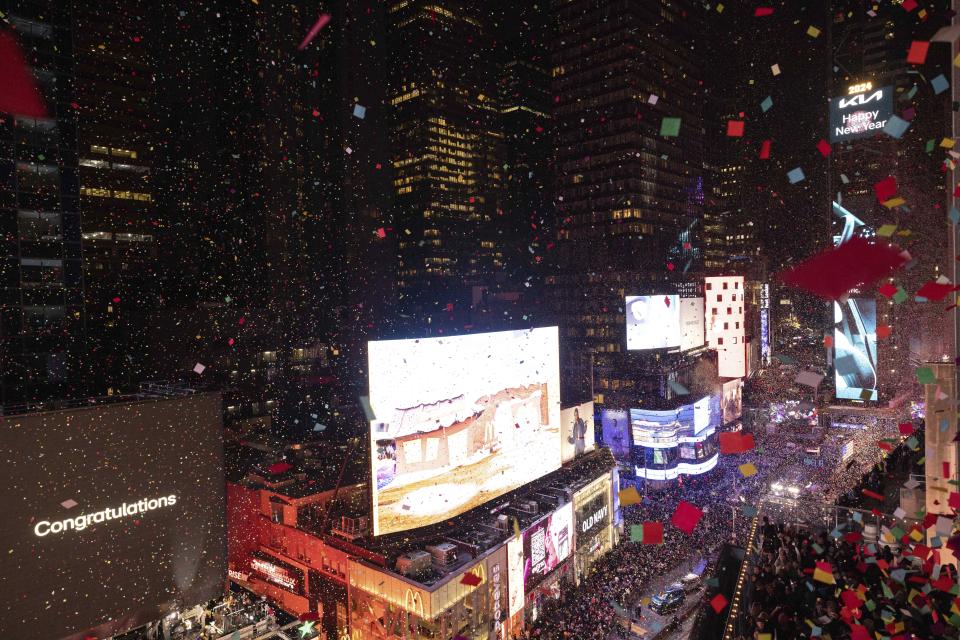 Confetti drops over the crowd as the clock strikes midnight as seen from the New York Marriott Marquis during the New Year's Eve celebration in Times Square, early Monday, Jan. 1, 2024, in New York. (AP Photo/Yuki Iwamura)