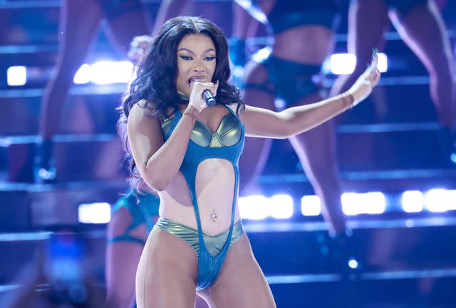 <p>Michael TRAN / AFP) (Photo by MICHAEL TRAN/AFP via Getty </p> Megan Thee Stallion performs on stage during the BET Awards at the Peacock theatre in Los Angeles on June 30, 2024