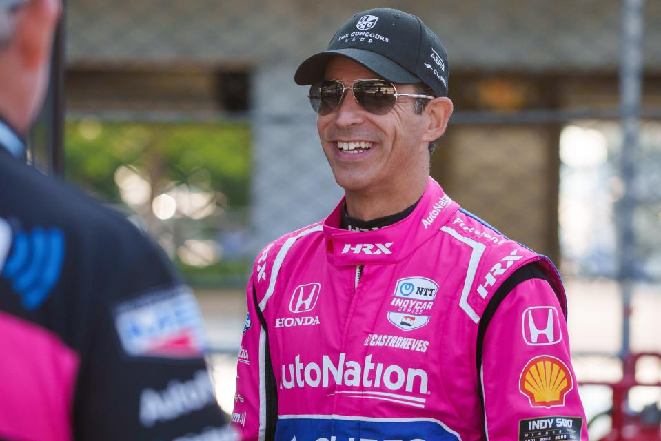 Meyer Shank Racing driver Hélio Castroneves (06) laughs with crew members Friday, Aug. 11, 2023, ahead of practice for the Gallagher Grand Prix at Indianapolis Motor Speedway. 