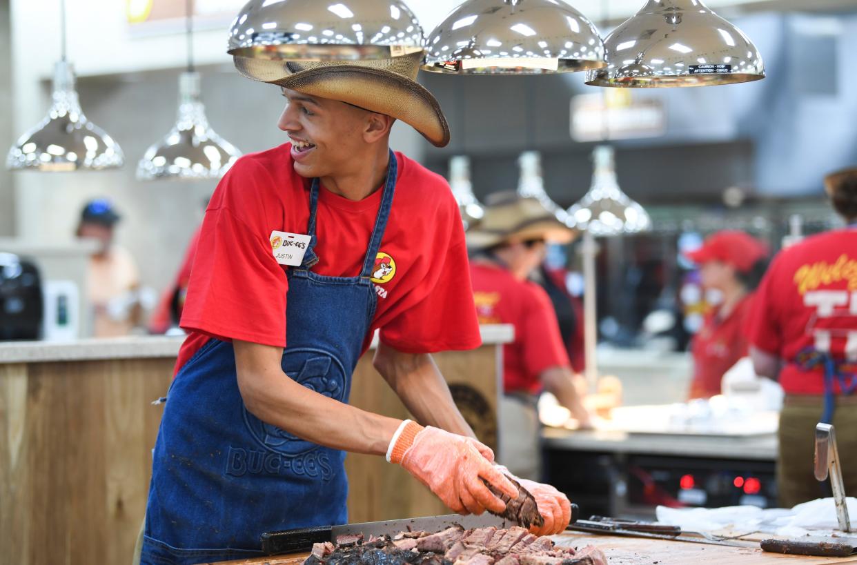 An employee chops brisket at a pre-opening event for first responders at the new Buc-ee’s at 170 Buc-ee’s Boulevard in Sevierville, Friday, June 23, 2023.