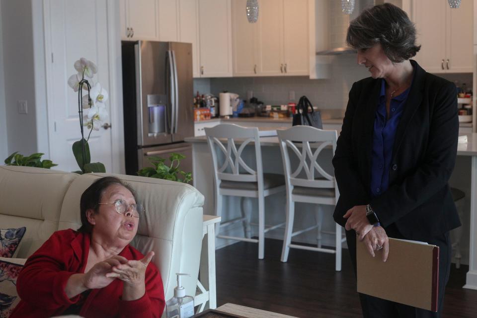Supee Spindler (left) speaks with her attorney, Joni Mazzola, at Spindler’s home, April 26, 2023.
