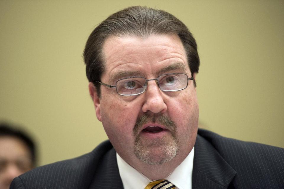 Patrick Sullivan, Assistant Inspector General for Investigations, Office of Inspector General, EPA, testifies before the House Oversight and Government Reform full committee hearing, Wednesday, May 7, 2014 in Washington. A turf battle between the Environmental Protection Agency's inspector general and an EPA unit run by President Barack Obama's political staff gets an airing before Congress. (AP Photo/Molly Riley)