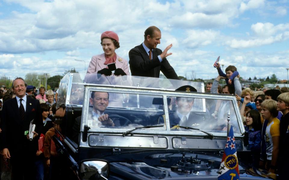 Queen Elizabeth ll and Prince Philip, Duke of Edinburgh wave to wellwishers from their open car in October 1981 in Wellington, New Zealand - Anwar Hussein/Getty Images
