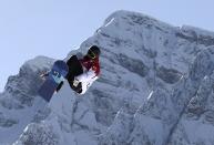 Canada's Maxence Parrot performs a jump during the men's snowboard slopestyle qualifying session at the 2014 Sochi Olympic Games in Rosa Khutor February 6, 2014. Parrot blazed into Saturday's final of the men's slopestyle event on Thursday and said he was confident Canada could still make a clean sweep of the medals despite injury worries. REUTERS/Dylan Martinez (RUSSIA - Tags: OLYMPICS SPORT SNOWBOARDING TPX IMAGES OF THE DAY)