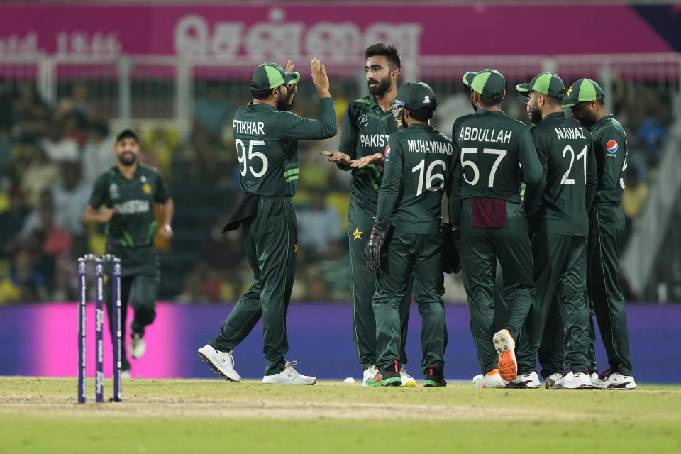 Pakistan's Usama Mir, without cap, celebrates with teammates the dismissal of South Africa's Rassie Van Der Dussen during the ICC Men's Cricket World Cup match between Pakistan and South Africa in Chennai, India, Friday, Oct. 27, 2023. (AP Photo/Mahesh Kumar A.)