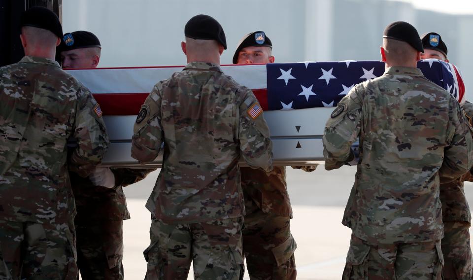 An Army carry team moves a transfer case containing the remains of U.S. Army Staff Sgt. Diobanjo S. San Agustin at Dover Air Force Base, Del. on Sept. 5, 2018, at Dover Air Force Base, Del. According to the Department of Defense, San Agustin of National City, Calif., died while supporting Operation Freedom's Sentinel. 