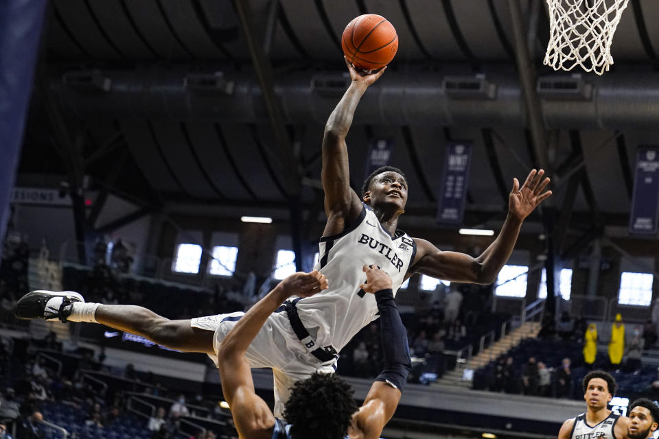 Butler guard Bo Hodges (1) is fouled as he shoots by Villanova forward Jermaine Samuels (23) in the second half of an NCAA college basketball game in Indianapolis, Sunday, Feb. 28, 2021. (AP Photo/Michael Conroy)