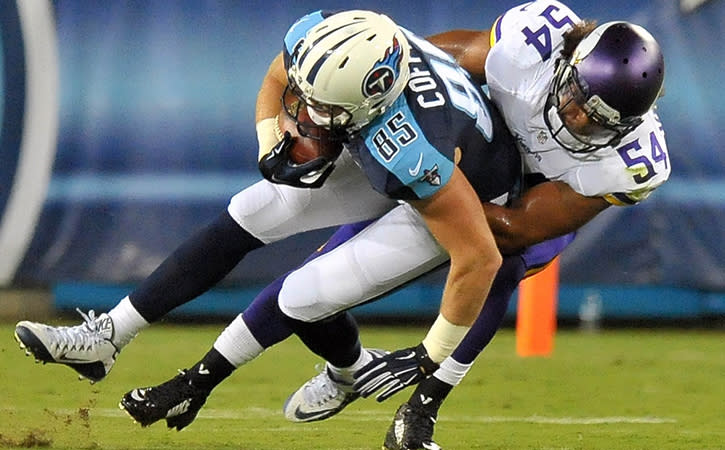 Sep 3, 2015; Nashville, TN, USA; Tennessee Titans tight end Chase Coffman is tackled by Minnesota Vikings inside linebacker Eric Kendricks during the first second half at Nissan Stadium.