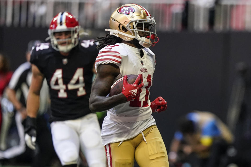 San Francisco 49ers wide receiver Brandon Aiyuk (11) runs into the end zone for a touchdown against the Atlanta Falcons during the first half of an NFL football game, Sunday, Oct. 16, 2022, in Atlanta. (AP Photo/Brynn Anderson)