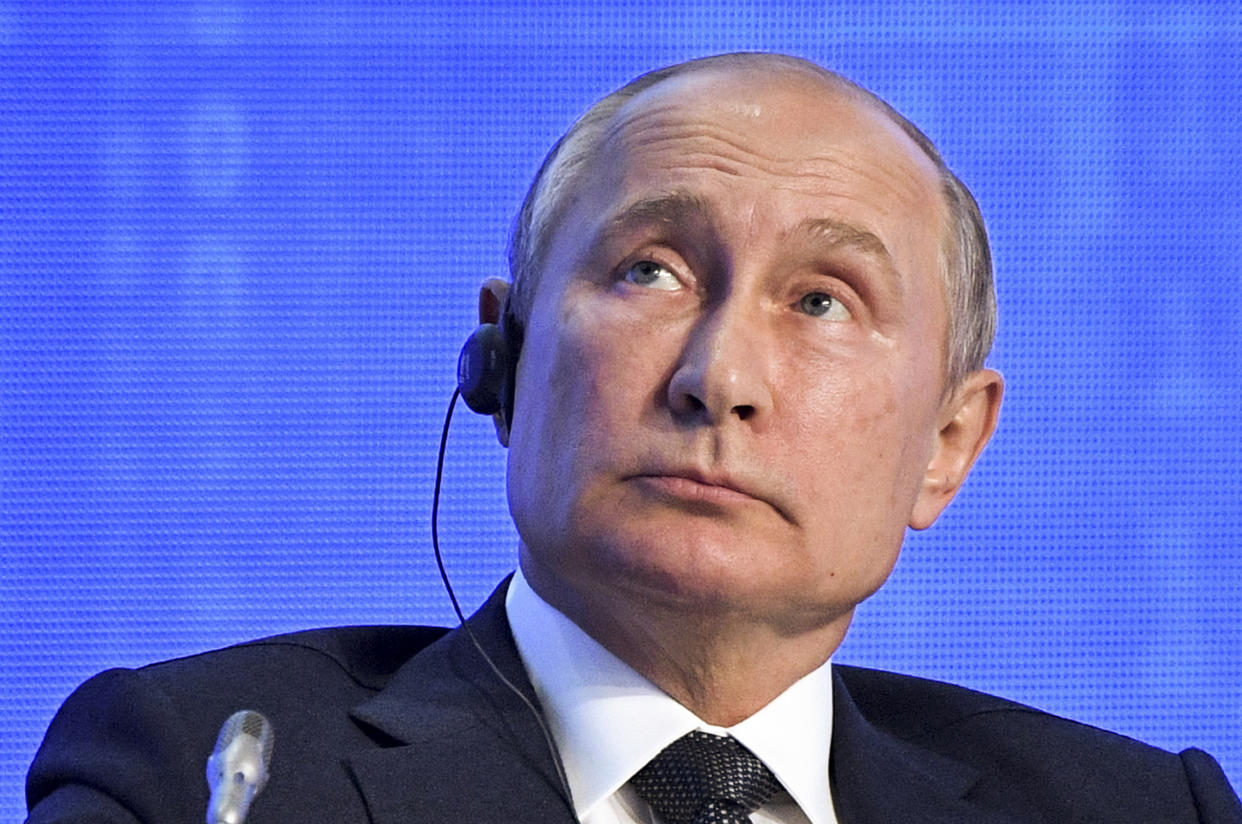 Russian President Vladimir Putin attends the 2019 Russian Energy Week forum in Moscow, Russia, Wednesday, Oct. 2, 2019. Saudi Arabia's Energy Minister Abdulaziz bin Salman is in the center. (Alexei Nikolsky, Sputnik, Kremlin Pool Photo via AP)