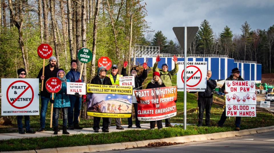 Protesters with Reject Raytheon Asheville at the Nov. 16 ribbon cutting of the new Pratt & Whitney facility.