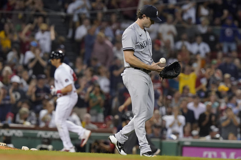 New York Yankees' Gerrit Cole, right, walks near the mound as Boston Red Sox's Triston Casas, left, runs the bases after hitting a two-run home run during the second inning of a baseball game Tuesday, Sept. 13, 2022, in Boston. (AP Photo/Steven Senne)