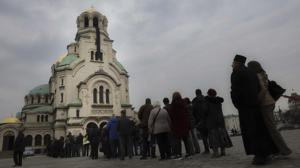 Bulgarian Orthodox believers wait in line to pay their last respects to Bulgarian patriarch Neophyte at the Alexander Nevsky Cathedral in Sofia, Friday, March 15, 2024. National mourning was declared by the Bulgarian government on March 15 and 16 to honour Patriarch Neophyte of Bulgaria. Neophyte who was the first elected head of the Orthodox Church in the post-communist Balkan country, died at a hospital in Sofia on March 13. He was 78. (AP Photo/Valentina Petrova)