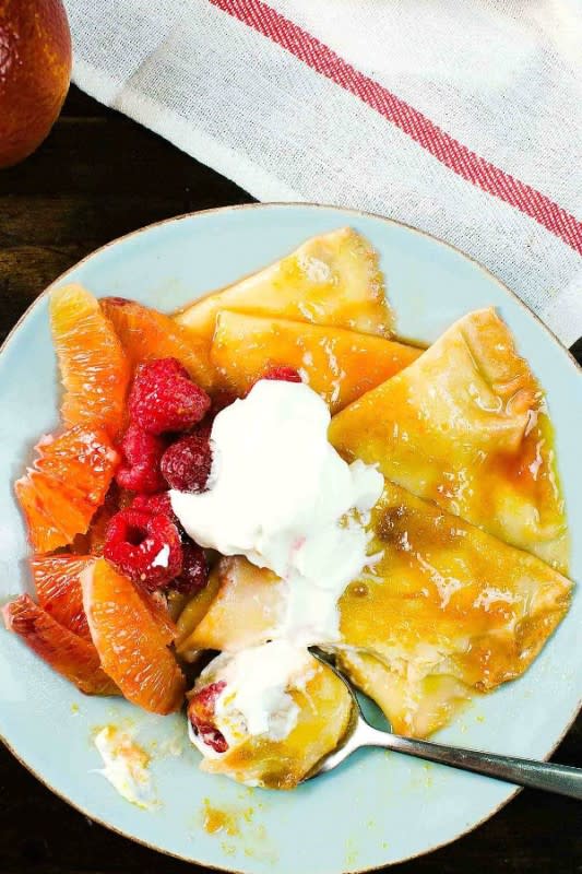 <p>The Flavor Bender</p><p>Pillowy soft crepes, coated in a blood orange-infused rich, buttery, citrusy caramelized syrup and served with extra blood orange segments, raspberries and a dollop of whipped cream.</p><p><strong>Get the recipe: <a href="https://www.theflavorbender.com/blood-orange-crepe-suzette-for-two/" rel="nofollow noopener" target="_blank" data-ylk="slk:Blood Orange Crepe Suzette for Two;elm:context_link;itc:0;sec:content-canvas" class="link rapid-noclick-resp">Blood Orange Crepe Suzette for Two</a></strong></p>