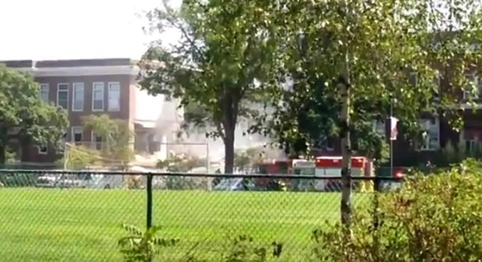 <p>Emergency vehicles attend the scene outside the Minnehaha Academy, after part of the Christian private school collapsed, in Minneapolis, United States August 2, 2017 in this image obtained from social media. (Syd Davenport-Fey/via Reuters) </p>