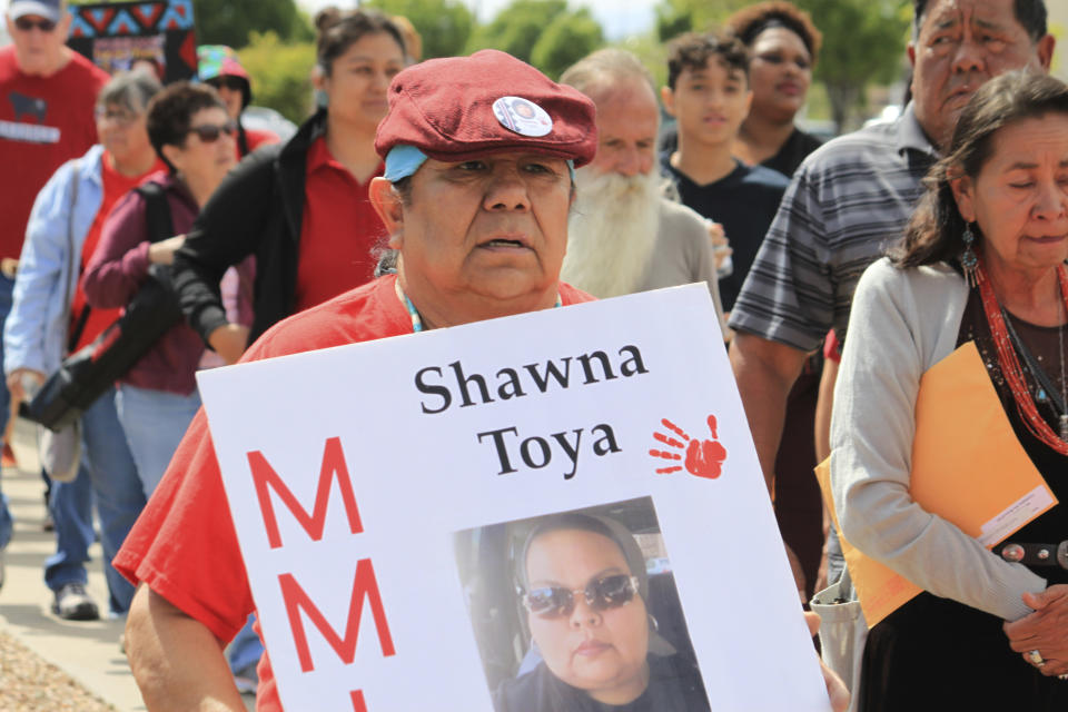 Benjamin Toya, center, marches to bring awareness to his daughter's death, in 2021, as dozens of people participated in Missing and Murdered Indigenous Persons Day in Albuquerque, N.M., Sunday, May 5, 2024. (AP Photo/Susan Montoya Bryan)