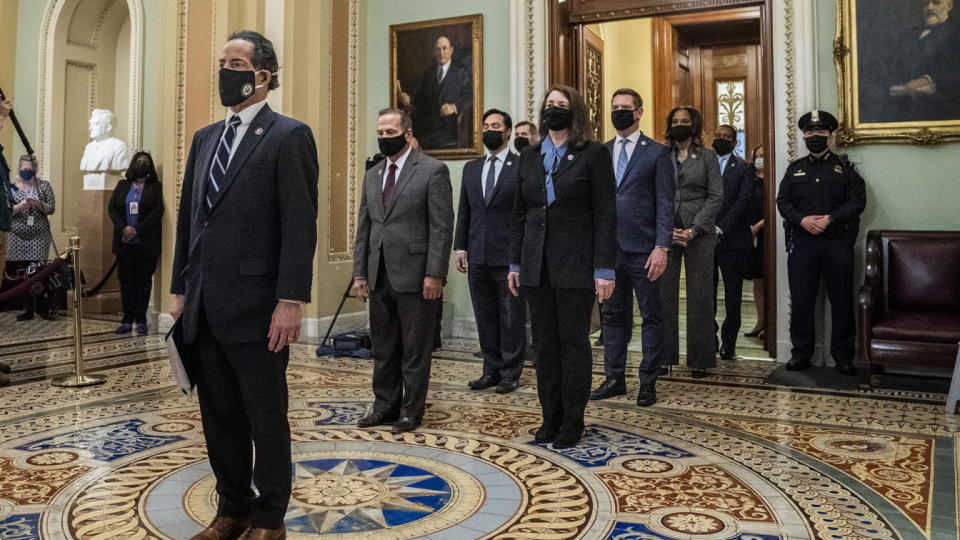 (L-R) Impeachment managers Representatives Jamie Raskin (D-MD), Diana DeGette (D-CO), David Cicilline (D-RI), Joaquin Castro (D-TX), Eric Swalwell (D-CA), Ted Lieu (D-CA), Stacey Plaskett (D-US Virgin Islands AT-Large), Joe Neguse (D-CO), and Madeleine Dean (D-PA) leave the Senate floor after delivering the article of impeachment on Capitol Hill on January 25, 2021 in Washington DC. (Melina Mara-Pool/Getty Images)