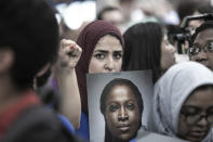 <p>A protester at a rally in New York City on June 20, 2018, holds a photo of a woman who was denied asylum because of President Trump’s immigration policy. (Photo: Gordon Donovan/Yahoo News) </p>