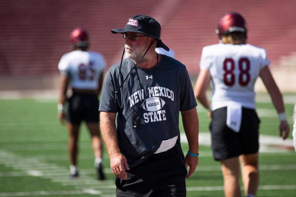 NMSU head coach Jerry Kill watches his team runs through drills during a practice on Wednesday, July 26, 2023, at the Aggie Memorial Stadium.