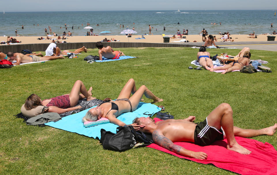 Sunbaking beachgoers at St Kilda soak up the sun last year.  Source: AAP