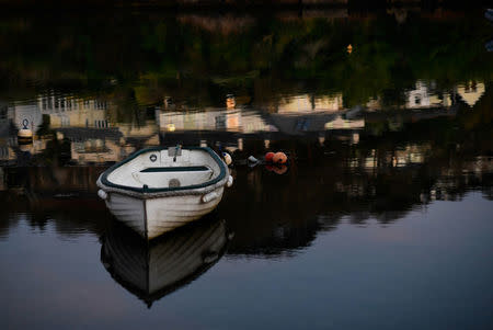 A boat floats on a creek flowing into the English Channel seen from Newton Ferrers, Devon, Britain April 11, 2017. REUTERS/Dylan Martinez