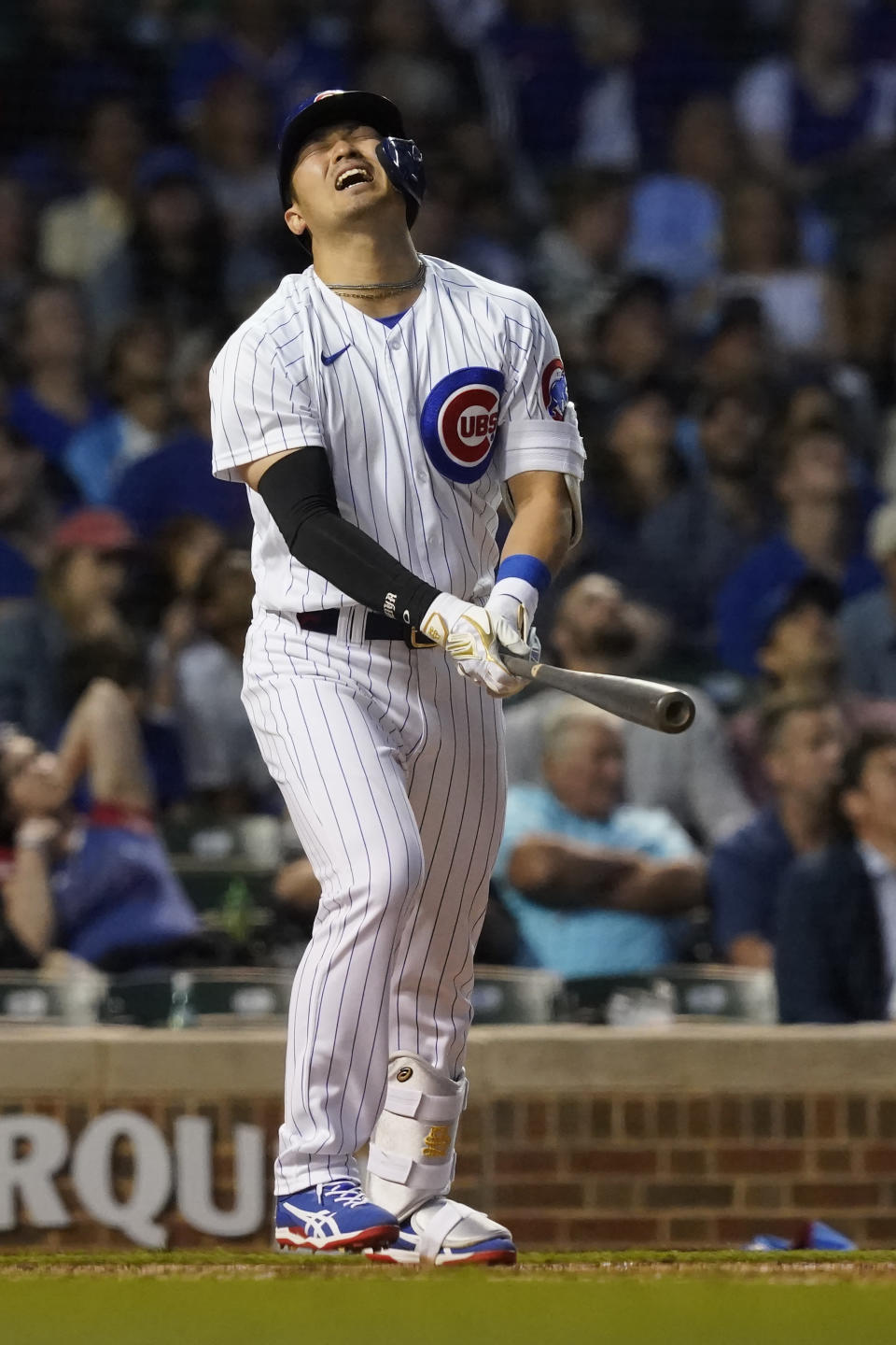 Chicago Cubs' Seiya Suzuki reacts to his infield pop up during the sixth inning of a baseball game against the Pittsburgh Pirates Monday, May 16, 2022, in Chicago. (AP Photo/Charles Rex Arbogast)