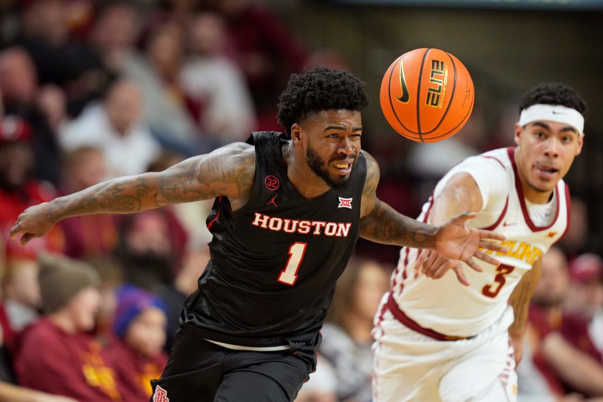 Houston guard Jamal Shead (1) steals the ball from Iowa State guard Tamin Lipsey (3) during the first half of an NCAA college basketball game, Tuesday, Jan. 9, 2024, in Ames, Iowa.