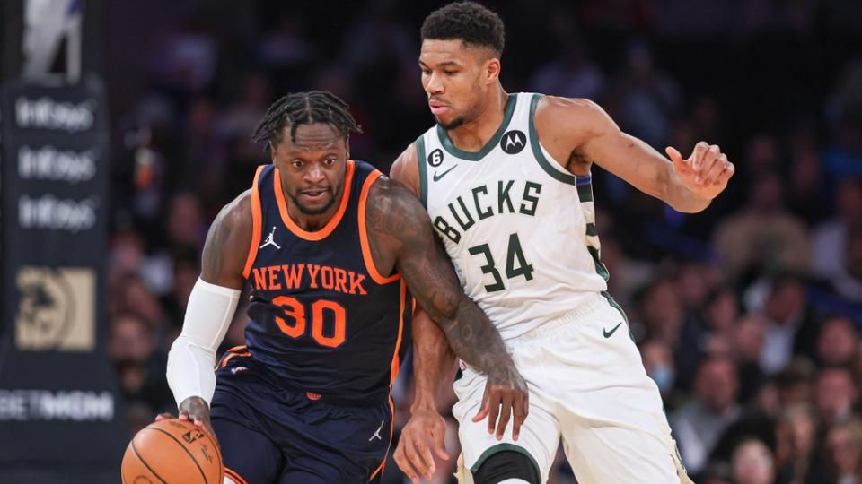 Nov 30, 2022; New York, New York, USA; New York Knicks forward Julius Randle (30) dribbles against Milwaukee Bucks forward Giannis Antetokounmpo (34) during the first half at Madison Square Garden.