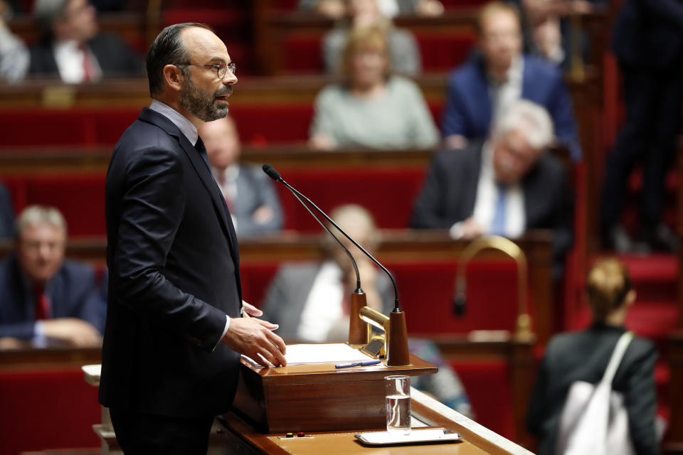 France's Prime Minister Edouard Philippe delivers a speech at the National Assembly, in Paris, Wednesday, June 12, 2019. France's prime minister vowed to keep reforming the country's economy through changes to the unemployment benefits, the pension system and tax cuts for middle-class workers. Edouard Philippe laid down Wednesday the government's upcoming priorities at the lower house of parliament, the National Assembly. (AP Photo/Thibault Camus)