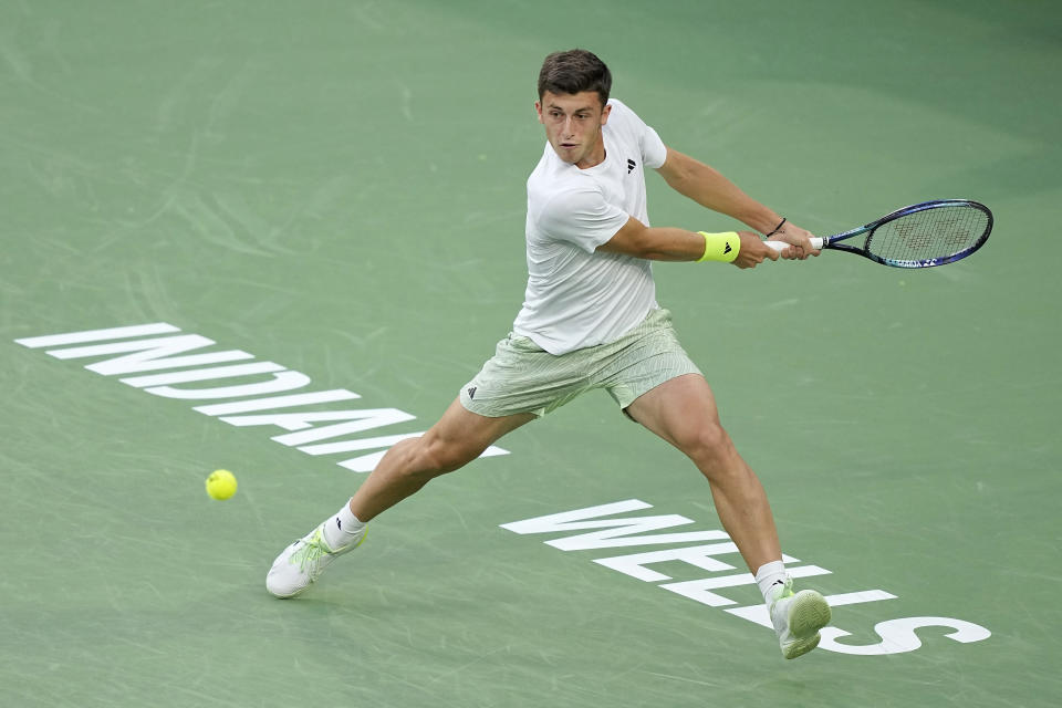 Luca Nardi, of Italy, returns a shot against Novak Djokovic, of Serbia, at the BNP Paribas Open tennis tournament, Monday, March 11, 2024, in Indian Wells, Calif. (AP Photo/Mark J. Terrill)