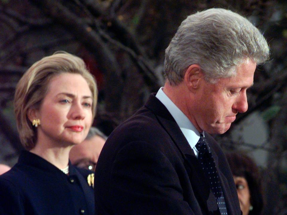 In this December 1998 file photo, first lady Hillary Rodham Clinton watches President Clinton as he thanks those Democratic members of the House of Representatives who voted against impeachment at the White House in Washington.