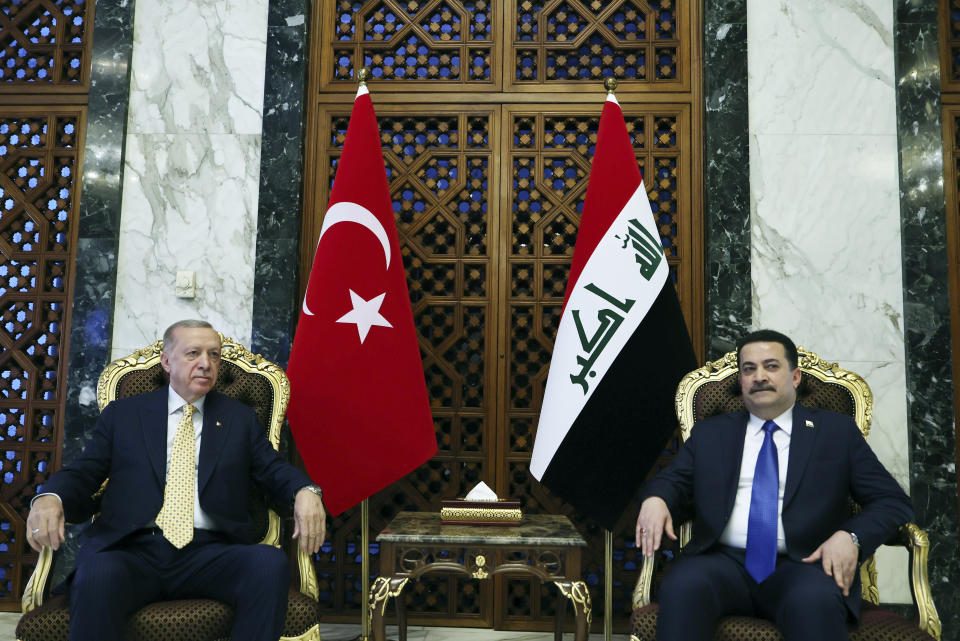 Iraqi Prime Minister Mohammed Shia al-Sudani, right, and Turkish President Recep Tayyip Erdogan meet in Baghdad, Iraq, Monday April 22, 2024. (Turkish Presidency via AP)